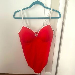 Red swim suit with white piping